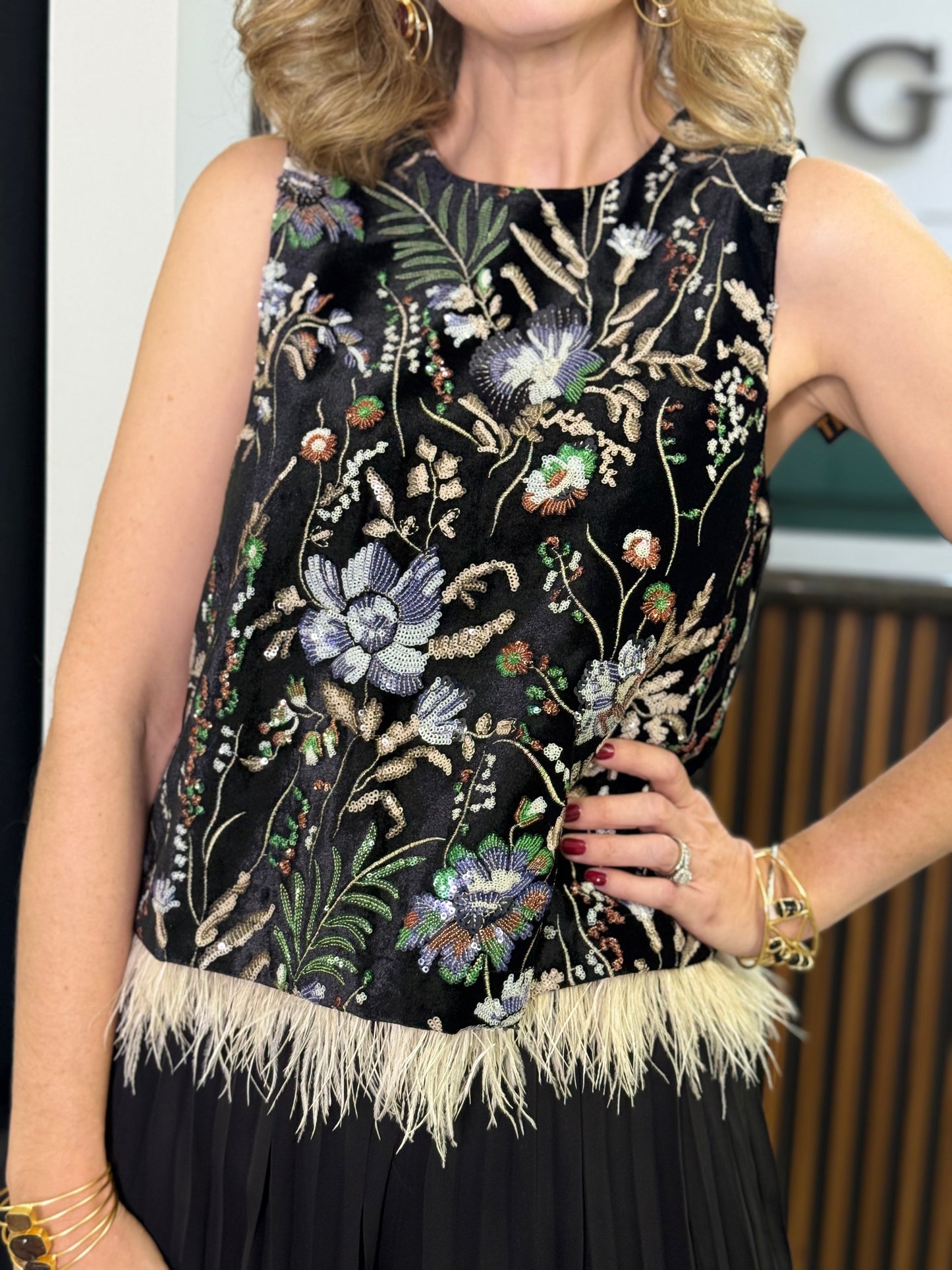 Blusa sin mangas plumas