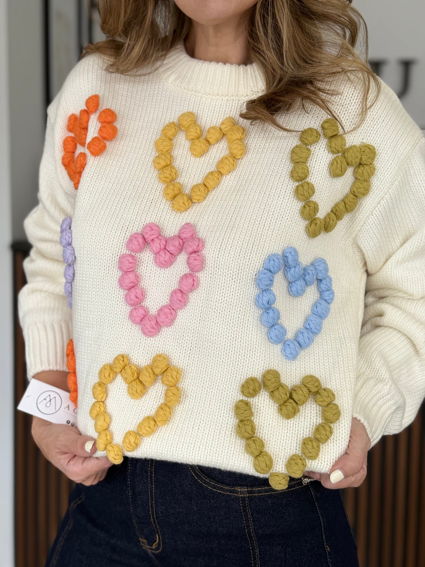 Suéter beige corazones colores
